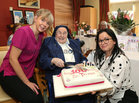 Sr Teresa Gilligan with St Mary’s Nursing Home staff, Linda Cunningham, Activities (left) and Karolina Lodyka, HR St Mary’s, holding her 100th Birthday cake.