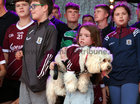 Galway Manager Pádraic Joyce's daughter Jodie holding her pet dog during the homecoming ceremony at Pearse Stadium on Monday evening.