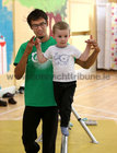 Julien Petersin gives a helping hand to Oisin on the  tightrope at the Galway Community Circus workshops in St Joseph's Community Centre, Shantalla as part of Culture Night last Friday.