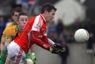 Corofin's, Michael Lundy,<br />
and<br />
Tuam Stars, Declan Byrne,<br />
during the County Senior Football Championship Final<br />
at Tuam Stadium.<br />
