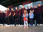 Galway manager Pádraic Joyce with his children Charlie and Jodie among players as they sing at the homecoming reception in Pearse Stadium on Monday for the Senior team and minor All-Ireland teams.