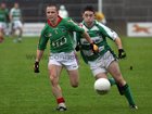 Oughterard's, Ronan Molloy,<br />
 and<br />
 Kilconly's, Kevin Brady,<br />
 during the County Intermediate Football Championship Final  at Pearse Stadium.