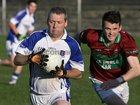 <br />
 St. James, David Henry,<br />
 and<br />
 Caherlistrane's, Padraig Reilly,<br />
during the County Junior(C) Football Championship Final at Tuam Stadium.<br />
