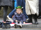 A young spectator awaiting the start of the Galway City St Patrick’s Day Parade.
