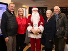 Pictured with Santa (Fred Diviney) at the Mervue and Renmore Community Christmas lunch in the Connacht Hotel were Art Friel, Mervue, Anne Abberton Egan, organiser and May and Sean O'Toole, Mervue.