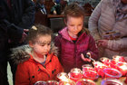 Amber Kirrane from Oranmore (left) and Hailie Flood, Athenry, lighting candles at the annual Solemn Novena at Galway Cathedral