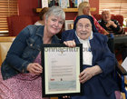 Yvonne Carpenter, Director of Nursing at St Mary’s Nursing Home, with Sr Teresa Gilligan during her 100th Birthday celebrations. They are holding Sr Teresa’s letter and gift from President Michael D Higgins.