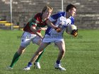 <br />
 St. James, Cathal Walsh,<br />
 and<br />
 Caherlistrane's, Enda Walsh,<br />
during the County Junior(C) Football Championship Final at Tuam Stadium.<br />
