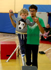 Julien Petersin gives a helping hand to Devin Langan on the  tightrope at the Galway Community Circus workshops in St Joseph's Community Centre, Shantalla as part of Culture Night last Friday.