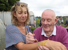 Volunteer Lily Kelly has her wrist painted by artist Clement Moylan at the Ballybane Community Garden Open Day.