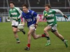 Kilconly's,Paraic Moran,<br />
and<br />
Oughterard's, Conrad Clancy and Martin Coady,<br />
during the Intermediate Football Championship Final<br />
Replay at Pearse Stadium.<br />
