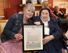 Yvonne Carpenter, Director of Nursing at St Mary’s Nursing Home, with Sr Teresa Gilligan during her 100th Birthday celebrations. They are holding Sr Teresa’s letter and gift from President Michael D Higgins.