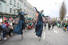 Macnas stilt walkers performing during the St Patrick’s Day parade as it passes up Prospect Hill.