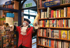 Galway Town Crier Liam Silke at the door of Charlie Byrne’s Bookshop on Middle Street while he was out on the city centre streets on Monday welcoming back shoppers and thanking staff and business owners, who have been able to reopen, after the easing of Covid-19 restrictions.