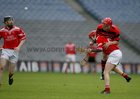 Cappataggle's Daniel Loughnane ships a heavy challenge from Blarney captain James Hughes.