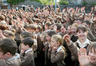 Pupils celebrate the official opening of the new extension to Scoil Fhursa at Nile Lodge.