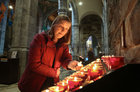 Una O'Connell of Barr na Cluana, Headford Road, lights a candle at the annual Solemn Novena at Galway Cathedral