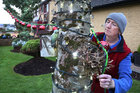 Pat McPhilbin placing Christmas lights and decorations on trees in his garden at Emmett Avenue in Mervue which has been chosen as the overall winner in the Galway City Tidy Town Competition. He also won first prize in the Mervue Residential Area category. 