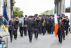 Flag bearers Garda Michelle Hallinan (left) and Garda Claire Burke lead the parade at Eyre Square at the start of the re-enactment of the arrival of the first Gardaí to Galway on 25th September 1922, during the commemoration by Gardaí in Galway of the 100-year anniversary of the foundation of An Garda Síochána last Sunday.