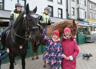 Little Blue Hero Eva Bikovica, right, and her sister Adele from Westside at Eyre Square last Friday for the arrival of The Maynooth Students for Charity Galway Cycle. Behind are Garda Mounted Support Unit members Garda Nives Caplice on Dualtaph and Garda Denis Farrell on Ruairi. The cycle, from Maynooth and back, covering 400 kilometers in total, was held in aid of Little Blue Heroes.<br />
Little Blue Heroes Foundation is a charity voluntarily led by Garda members, retired Garda members and civic minded people from communities which is funded entirely by donations and fundraising. The foundation supports families of children with serious illnesses in Ireland while empowering the lives of children through positive community engagement. Their mission is to provide  support to families of children who have serious illnesses in Ireland while granting the wish of the children to become Honorary Gardaí to empower the child and foster positive engagement with An Garda Síochána. 