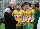 President Michael D Higgins is introduced to the corofin players by joint team captain Micheál Lundy before the start of the AIB GAA Football All-Ireland Senior Club Championship final at Croke Park.