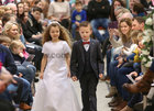 Niamh Baynes Gaelscoil de hIde, and Liam Murphy, Scoil Caitriona, taking part in Anthony Ryans Annual Communion Wear Fashion Show. 