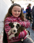 Sive Casburn(9) from Barna with 10 weeks old collie terrier Jack at the MADRA Adoption Day in the sportshall at GMIT.