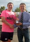 At the finals night of Tag Rugby at Galway Corinthians at Corinthian Park, Cloonacauneen.<br />
<br />
Lorcan Smyth, captain of 11 Wise Monkeys, winners of C Grade League 2 receives the trophy from Declan Russell, President of Galway Corinthians RFC