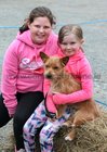 Maeve Dickinson from Clifden and Emma Madden, Cleggan, with her pet Max, at the dog show during the annual Maam Cross Connemara Pony Show.