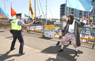 A garda joins in the fun as two pirates perform during SeaFest last weekend.