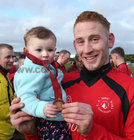Eamonn Ó Loinsigh celebrates with his daughter Ella (18 months) after Mac Dara, Carraroe, were presented with the Division 3 Cup at Millars Lane in Galway city last weekend.