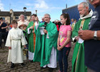 Fr Fonsie Flatley, accompanied by Fr Hugh Clifford P P, Kinvara (left) and Fr Anthony Keane of Glenstal Abbey, blesses the boats at Kinvara Pier during the Cruinniu na mBad Festival last weekend. Fr Flatley has recently returned home to Kinvara following missionary work in Nigeria.