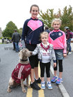 Sisters Ellen,Hannah Sarah Deely of Salthill GAA Club with their pet Roxy at the minor and senior hurling teams homecoming at the Pearse Stadium.