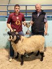Tommy Joe Gallagher, judge (right) with Padraig Kerrigan from Glentrague with his best aged ram of the sheep show at the annual Maam Cross Connemara Pony Show.
