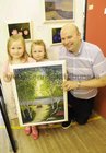 <br />
Declan Gannon, Salthill, with his daughters Isabelle and Sarah, with their grandmothers painting in which they feature    at the opening of Galway Art Club Exhibition at St. Patricks National School , Lombard Street. 