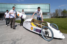 Engineering students roll a super fuel-efficient car after it was unveiled at NUI Galway. The Geec (Galway nenergy-efficient car) designed and road tested by NUI Galway engineering students, will represent Ireland next month in the prototype electric category at Shell Eco-marathon Europe in Rotterdam. Success is measured on who can drive the furthest on the equivalent of 1 kilowatt-hour of electricity or 1 liter of fuel. Designed from scratch the car is efficient enough to drive from Galway to Dublin on less than €1 worth of electricity, the equivalent of 1,700 miles per gallon of fuel.<br />
