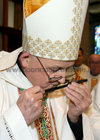 Bishop Brendan Kelly, the new Bishop of Galway, Kilmacduagh and Apostolic Administrator of Kilfenora, kisses the crucifix, presented to him by Canon Michael McLoughlin, outgoing Diocesan Administrator, during his Installation as Bishop of Galway at Galway Cathedral on Sunday.