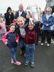 Maeve Broderick from Duniry with her daughter Tara and son Eanna who is holding the Liam McCarthy cup before the start of the Galway Memorial Walk in aid of Galway Hospice last Sunday.