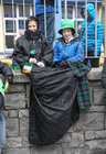 Keeping warm while awaiting the start of the St Patrick's Day parade in the city.