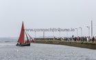 The 137 year-old Gleoiteog, the Lovely Anne, sails by Nimmos Pier into Claddagh Quay during it's re-launch.