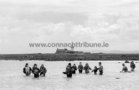 Mutton Island<br />
Returning from Mutton Island as the tide comes in during a walk to the island in June 1990. Since then, a sewage treatment plant has been built on the island, with a causeway linking the island to South Park. The newer photo is of compwetotirs taking part in the Simon Galway Women's 8K Mini Marathon recently.