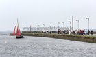 The 137 year-old Gleoiteog, the Lovely Anne, sails by Nimmos Pier into Claddagh Quay during it's re-launch.