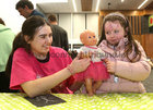 Scoil Ide, Salthill, pupil Sophia has her doll checked by Medical student Hannah Finn at the Teddy Bear Hospital in the Bailey Allen Hall, University of Galway