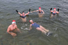 Helen McGourty, front, and from left: Kevin McGlade, Charlene Murphy, Nina McGlade and Jackie Browne from Kinvara and Galway after finishing their Christmas Day swim for Cope Galway at Blackrock.