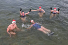 Helen McGourty, front, and from left: Kevin McGlade, Charlene Murphy, Nina McGlade and Jackie Browne from Kinvara and Galway after finishing their Christmas Day swim for Cope Galway at Blackrock.