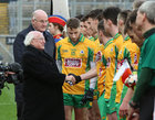 President Michael D Higgins is introduced to the corofin players by joint team captain Micheál Lundy before the start of the AIB GAA Football All-Ireland Senior Club Championship final at Croke Park.