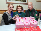 Bridie Daly, with her daughter Maryanne Volk and her husband Bill Volk, as she cuts her 106th birthday cake in O'Meara's, Portumna