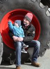 Keith Daly with his son Oisin Daly (18 months) looking at the display of tractors at Athenry Mart last Sunday before the start of the East Galway Tractor Run in aid of Hand in Hand, the Children's Cancer Charity. Keith, who is from Athenry, is now farming in Essex. Hand in Hand is a non-profit organisation which provides the families of children with cancer with much-needed practical support.