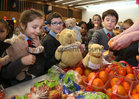 Pupils from St James National School, Bushypark, choosing some fruit during the Teddy Bear Hospital in the Bailey Allen Hall, University of Galway