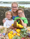 Avital Dines of Oranmore with her children Carla and Otis with some of their Galway Bay Alotments home grown organic vegetables at Oranmore Castle Heritage Fair last weekend.